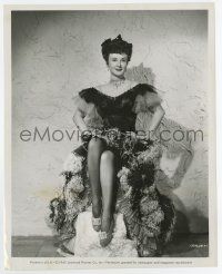7m856 VIGILANTES RETURN 8x10 still '46 seated Margaret Lindsay modeling a cool feathered dress!