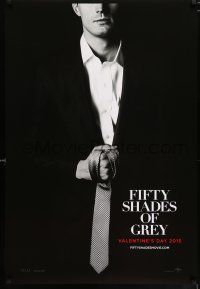 7r235 FIFTY SHADES OF GREY teaser DS 1sh '15 Jamie Dornan in the title role holding tie!