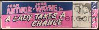 8m067 LADY TAKES A CHANCE paper banner R50 great image of John Wayne holding Jean Arthur!