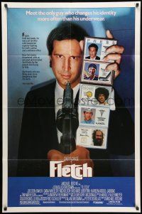 8p305 FLETCH 1sh '85 Michael Ritchie, wacky detective Chevy Chase has gun pulled on him!