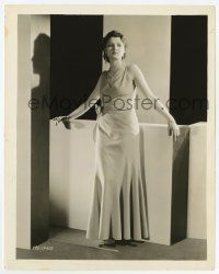 8s485 LILIAN BOND 8x10.25 still '30s full-length with pensive look leaning against backdrop!