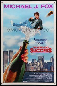 8w692 SECRET OF MY SUCCESS 1sh '87 wacky image of Michael J. Fox & huge bottle of champagne!