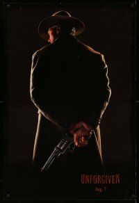 9c790 UNFORGIVEN dated teaser 1sh '92 classic image of gunslinger Clint Eastwood w/back turned!