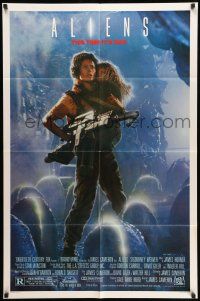 9f031 ALIENS 1sh '86 James Cameron, Sigourney Weaver as Ripley holding Carrie Henn!