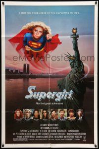 9f847 SUPERGIRL 1sh '84 super Helen Slater in costume flying over Statue of Liberty!