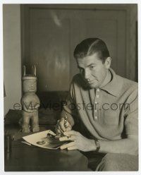 9h188 BRUCE CABOT 7.5x9 still '33 signing a photo for a fan by one of his totem collection!