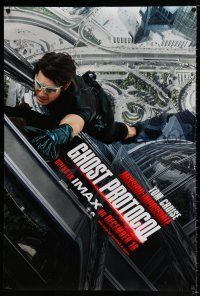 9k496 MISSION: IMPOSSIBLE GHOST PROTOCOL teaser DS 1sh '11 image of Tom Cruise climbing!