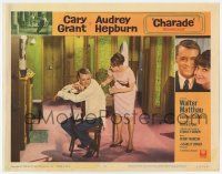 9r607 CHARADE LC #5 '63 sexy Audrey Hepburn prepares to put medicine on Cary Grant's back!