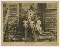 9r651 DOG'S LIFE LC '18 classic close image of Charlie Chaplin sitting with his beloved dog!