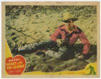 9r719 HEART OF THE RIO GRANDE LC '42 full-length close up of cowboy Gene Autry on ground w/gun!