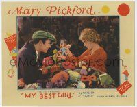 9r817 MY BEST GIRL LC '27 Buddy Rogers laughs as Mary Pickford shows him a pile of toys!