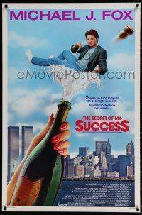 9w650 SECRET OF MY SUCCESS 1sh '87 wacky image of Michael J. Fox & huge bottle of champagne!