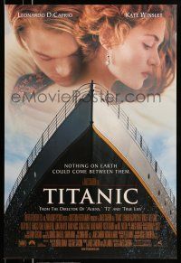9w764 TITANIC style A revised int'l DS 1sh '97 romantic image of Leonardo DiCaprio & Kate Winslet!