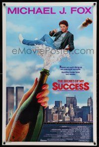 1k667 SECRET OF MY SUCCESS 1sh '87 wacky image of Michael J. Fox & huge bottle of champagne!