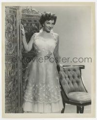 1m549 KATHRYN GRAYSON 8.25x10 still '50s full-length modeling a pretty pleated gown by chair!
