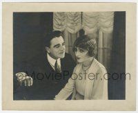 1m944 UNKNOWN STILL 7.75x9.5 still '20s guy with bandaged arm pleads with lady!