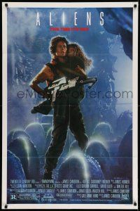 1p029 ALIENS 1sh '86 James Cameron, Sigourney Weaver as Ripley holding Carrie Henn!