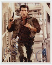2d0875 PIERCE BROSNAN signed color 8x10 REPRO still '00s great close up running with gun in hand!
