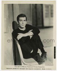 2s739 PSYCHO 8x10.25 still '60 seated portrait of Anthony Perkins with feet in chair, Hitchcock!