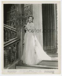 2s756 REBECCA 8.25x10 still R48 Hitchcock, Joan Fontaine full-length in white dress on stairs!