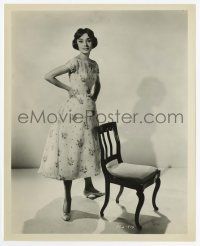 4d219 AUDREY HEPBURN 8.25x10.25 still '57 full-length posing by chair from Love in the Afternoon!