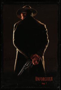 4w944 UNFORGIVEN teaser DS 1sh '92 image of gunslinger Clint Eastwood w/back turned, dated design!