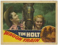 5w971 WAGON TRAIN LC '40 Tim Holt would rather look at his horse than pretty Martha O'Driscoll!