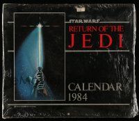 6a166 RETURN OF THE JEDI calendar '83 hands holding lightsaber by Tim Reamer on cover!