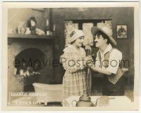 6d008 DOG'S LIFE 8x10 LC '18 Charlie Chaplin's rake gets tangled with Edna Purviance's pitchfork!