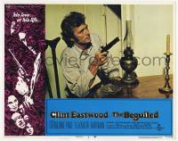 6j043 BEGUILED LC #1 '71 c/u of Clint Eastwood sitting at table pointing gun, Don Siegel!