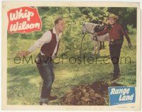 6j401 RANGE LAND LC #5 '49 laughing Whip Wilson attempts to whip the stick from Andy Clyde's mouth!