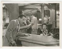 7d267 CONFLICT 8x10.25 still '45 Alexis Smith watches Humphrey Bogart looking over her desk!