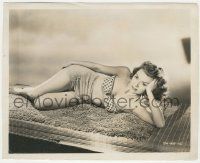 7d314 DOROTHY MCGUIRE 8x10 key book still '50s laying on bamboo mat in sexy two-piece swimsuit!