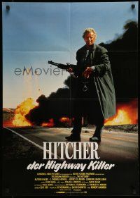 7r738 HITCHER German '86 image of Rutger Hauer with giant gun in front of explosions!