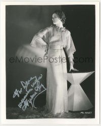 7x1345 MYRNA LOY signed 8x10 REPRO still '80s full-length modeling great dress over dark background!