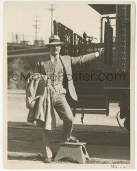 9m430 JOHN GILBERT 8x10.25 still '25 full-length & smiling, about to board the back of a train!