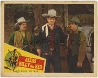 2d020 ALIAS BILLY THE KID LC '46 c/u of two bad guys holding cowboy Sunset Carson at gunpoint!