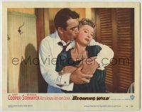 2d077 BLOWING WILD LC #8 '53 Anthony Quinn grabs bored Barbara Stanwyck from behind & kisses her!