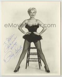 2j0450 BETTY GRABLE signed deluxe 8x10 still '55 full-length showing off her sexy legs in fishnets!