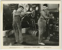 2w666 MODERN TIMES 8x10.25 still '36 c/u of Charlie Chaplin pointing oil can at barechested guy!