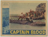 3c385 CAPTAIN BLOOD LC '35 pirates watch Errol Flynn fighting Basil Rathbone on rocky beach!