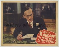 3c554 MYSTERY OF MR WONG LC '39 close up of Asian detective Boris Karloff examining letter!