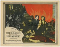 3c637 SATURDAY NIGHT LC '22 montage of Leatrice Joy, Conrad Nagel & cast by fire, Cecil B. DeMille