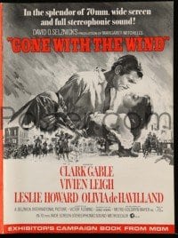 3y058 GONE WITH THE WIND pressbook R67 art of Clark Gable & Vivien Leigh over burning Atlanta!