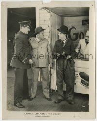 4m193 CIRCUS 8x10.25 still '28 cop grabs man by shocked Tramp Charlie Chaplin holding wallet!