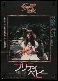 4y788 PRETTY BABY Japanese '78 directed by Louis Malle, young Brooke Shields sitting with doll!