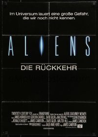 6g595 ALIENS German '86 James Cameron sci-fi sequel, Sigourney Weaver as Ripley carrying Carrie Henn