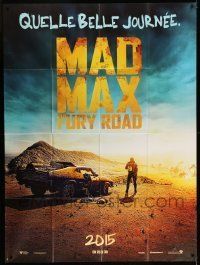 6p813 MAD MAX: FURY ROAD teaser French 1p '15 great image of Tom Hardy standing by his car!