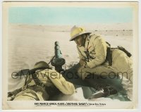7h009 ANOTHER DAWN color 8.25x10.25 still 1937 Errol Flynn behind machine gun on desert dunes!