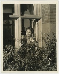 7h199 ANTHONY ADVERSE deluxe 8x10.25 still 1936 Olivia De Havilland smiling through window!